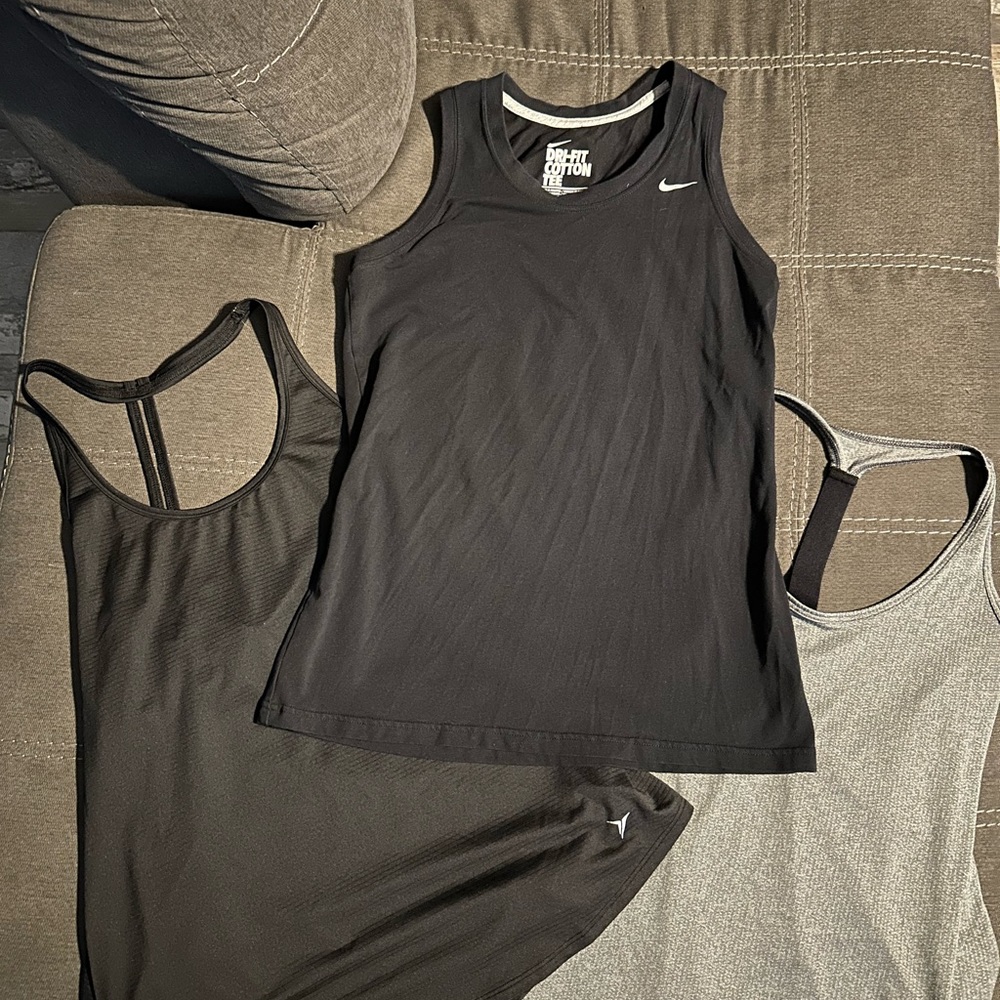 Three gym tanks
